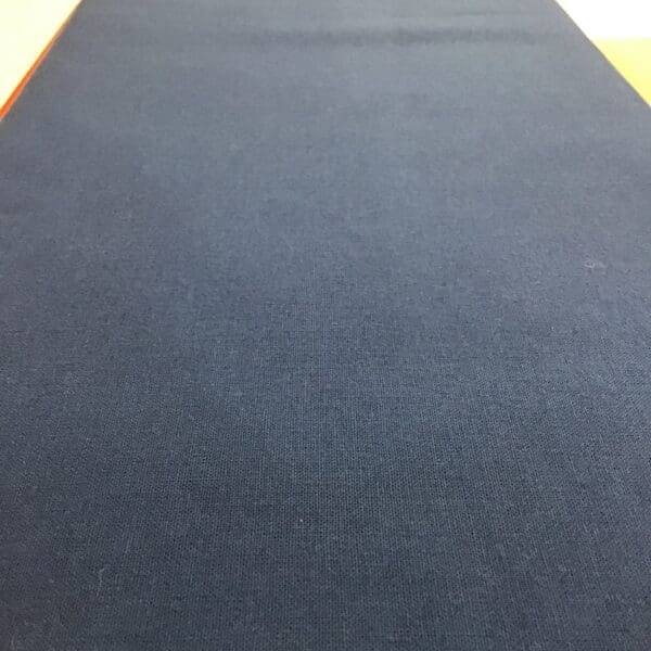 Solid navy plain fabric by Reynard